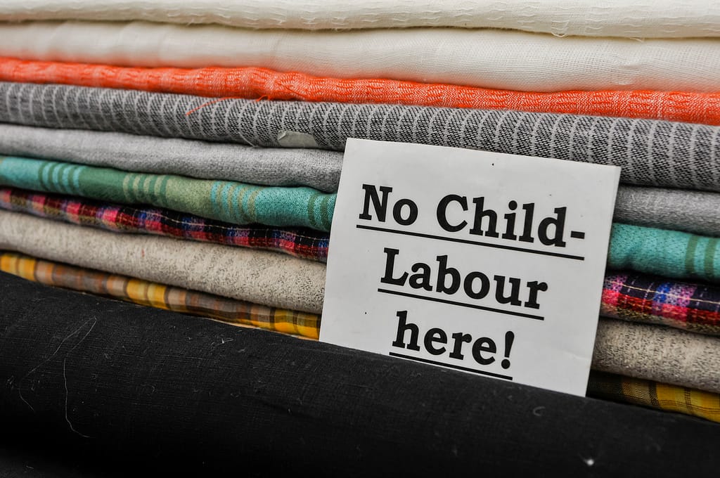 Sign at a cloth shop advising customers the no child labour is used in the production of their goods.